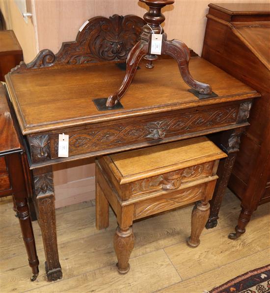 A carved oak green-man side table and similar smaller table W.91cm and 46cm